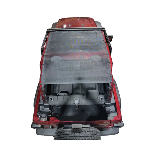 Red 2-door Jeep Wrangler JL with a black mesh Hothead Sunshade installed, viewed from above.