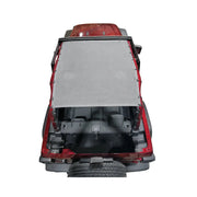 Gray mesh Hothead Sunshade installed on a red 2-door Jeep Wrangler JL.