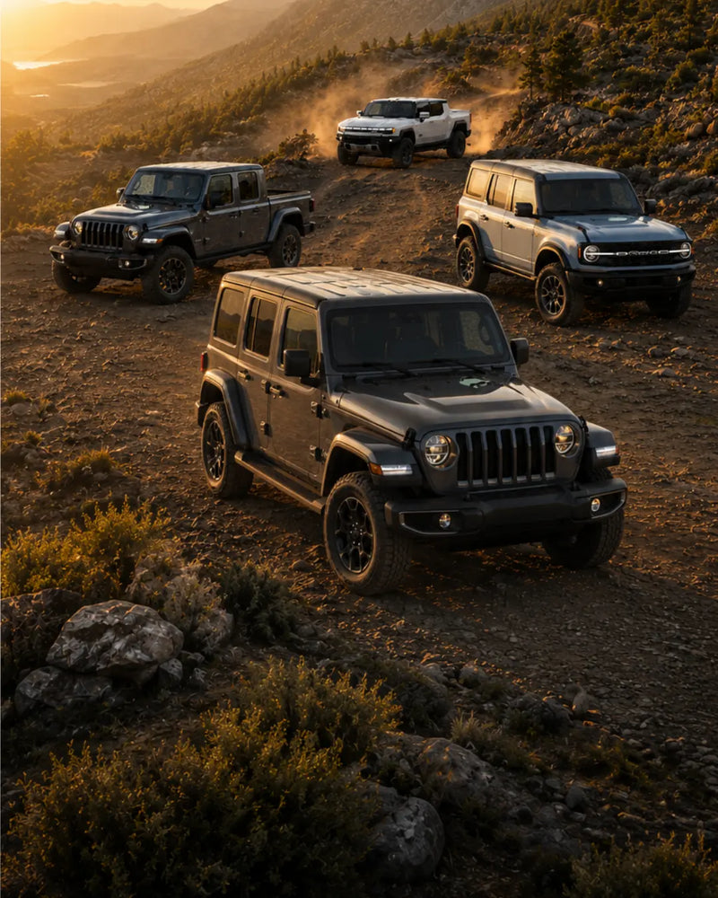 Vertical golden-hour mountain trail scene with Jeep Wrangler, Jeep Gladiator, Ford Bronco, and GMC HUMMER EV.
